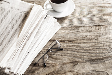 Newspaper on wooden table
