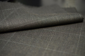 close up roll brown with white line fabric of suit