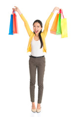 Happy Asian girl with shopping bags