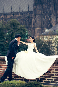 Chinese cute young newlyweds outdoor