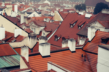 Terracotta tiled roofs with chimneys