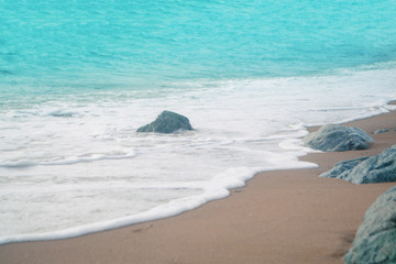 Blue sea wave and stone beach  background 