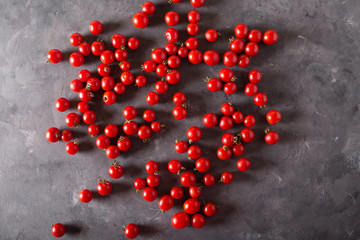 Cherry tomatoes. Colorful tomatoes Tomatoes background. Fresh tomatoes Healthy food concept. Colorful festive still life. Loosely laid tomatoes in different positions.