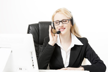 Female office assistant has a call at the office