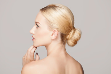 Fashion blonde woman with beautiful face - isolated on white. Skin care concept.