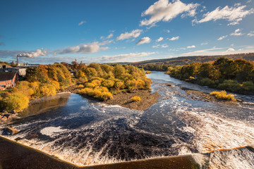 Fototapeta na wymiar River Tyne below Hexham Bridge, and Weir, on a sunny day in autumn