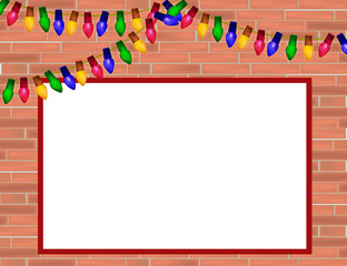 Red  brick wall with Christmas lights and frame for some text.