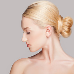 Fashion blonde woman with beautiful face - isolated on white. Skin care concept.