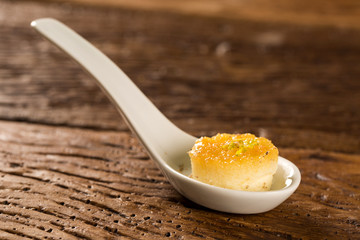 Tapioca pudding with tirage - spice native to the Amazon region in a spoon. Taste gastronomy fingerfood