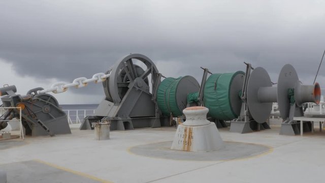 Anchor winch with chain and mooring winch of large vessel