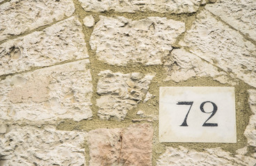 House number 72 sign.