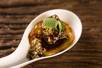 Pork tongue, ground banana, Marsala reduction, water meal and Mini watercress in a spoon. Taste gastronomy fingerfood