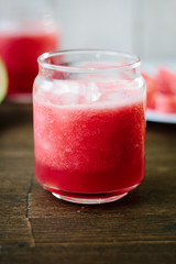 Delicious watermelon smoothie on the wooden board. Smoothie - vegetarian coctail from fresh fruit - watermelon