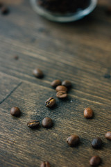 Coffee beans on black wooden board.