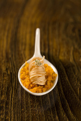 Crispy shrimp with piranha pirão and palm tree farofa in a spoon. Taste gastronomy finger food