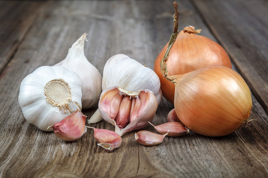 Fresh garlic on a wooden background