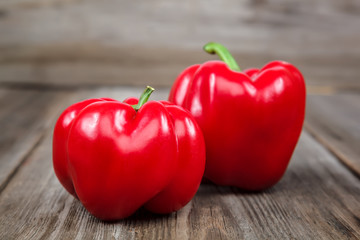 Red sweet pepper on a wooden background