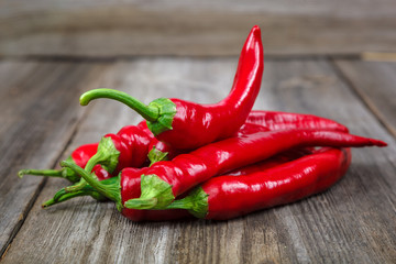 Red hot peppers on wooden background