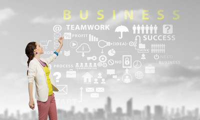Presenting her business success plan . Mixed media
