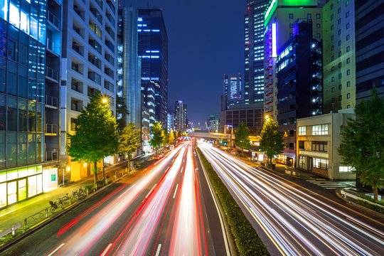 Cityscape of Shinjuku district with traffic lights on the street of Tokyo, Japan