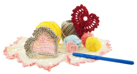 knitwear, yellow, red, blue, grey ball of yarn, crochet red hearts