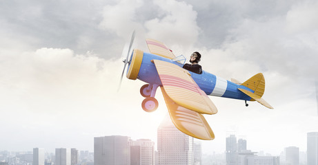 Woman in drawn airplane . Mixed media