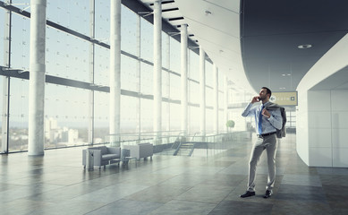 Fototapeta premium Businessman making calls . Mixed media