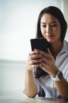 Businesswoman using mobile phone