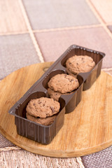Brown biscuits cookies with chocolate in plastic packaging