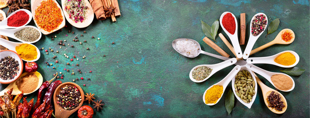 various spices on old green background