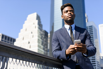 Young african businessman working on the laptop outdoor