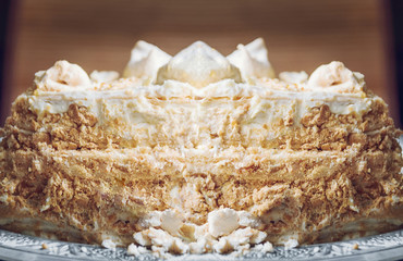 a homemade puff cake with meringue on a white plate closeup