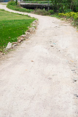 curved muddy pathway in a field