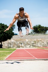 Athlete performing a long jump