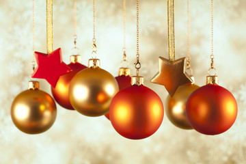 Christmas baubles and stars on abstract background