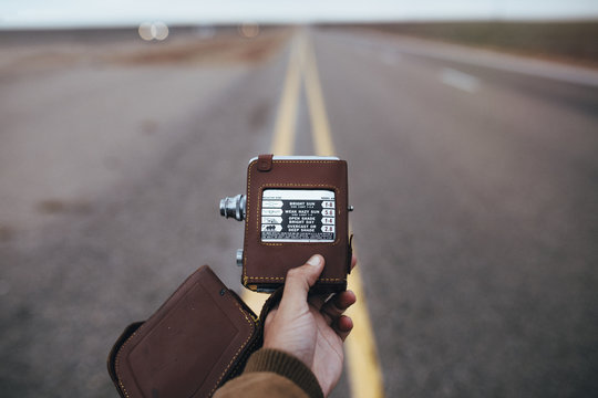 Hand holding retro camera
