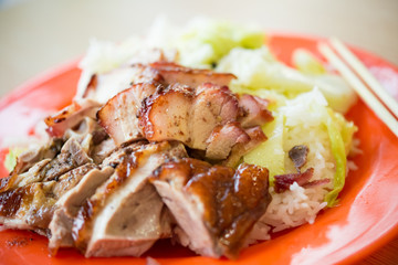 fast food of barbeque pork and roasted duck with rice and cabbage