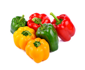 colored peppers over white background