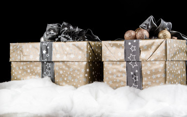 Christmas gifts with snow on a black background
