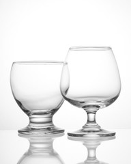 Empty wine glasses closeup shot on white isolated.