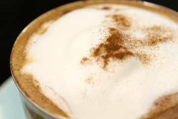 Hot cappuccino coffee in cup.