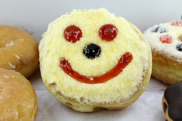 Closeup image of assorted sweet donuts.