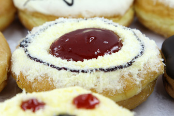 Closeup image of assorted sweet donuts.