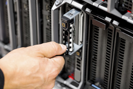 IT Engineer's Hands Repairing Server At Data Center