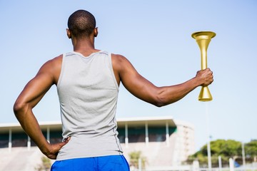 Athlete holding a fire torch