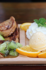 Honey toast : French toast , fresh fruit and ice cream with caramel sauce.