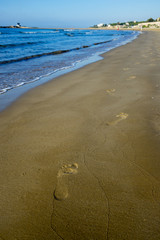 Footprints on the sand beach