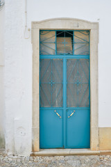 Door with metal shutter, old wall exterior background outdoors