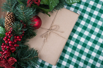 Christmas gift with red balls and garland