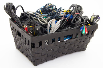 Big pile of computer cables neatly sorted in box - basket - isolated on white